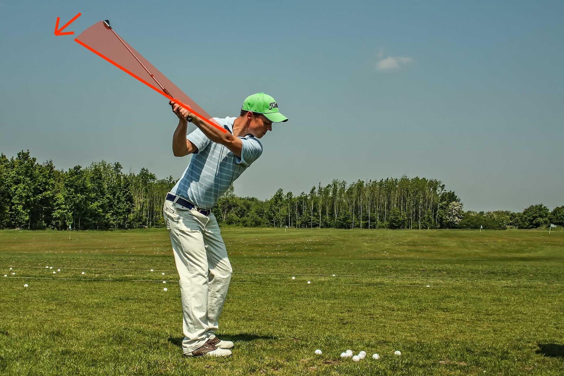 a player with a shallow golf swing
